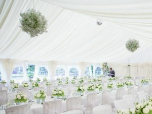 White wedding, white roses and lining with floral hanging